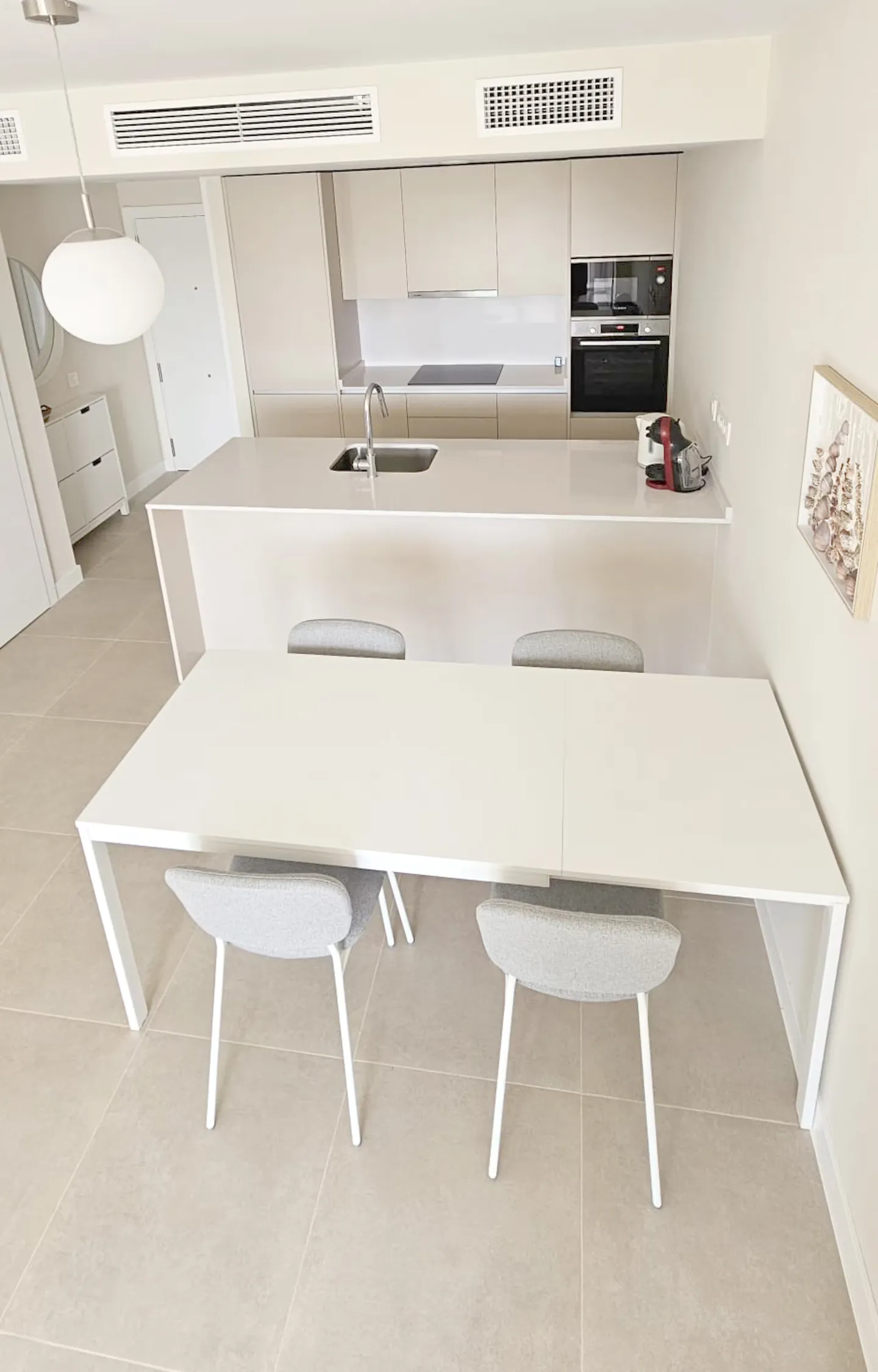 Estepona · Kitchen / dining area — before HostRev