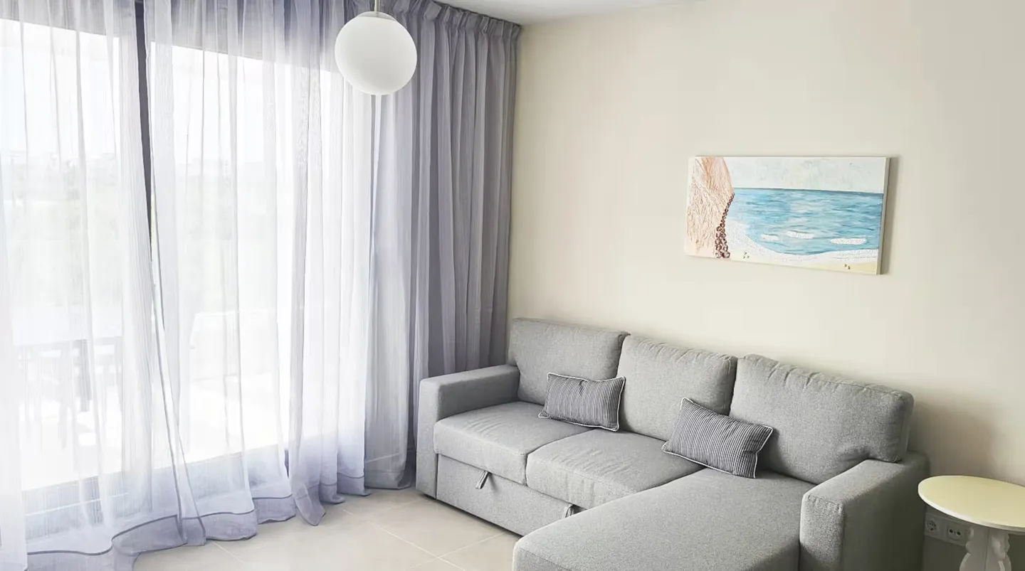 Estepona · Living room — before HostRev